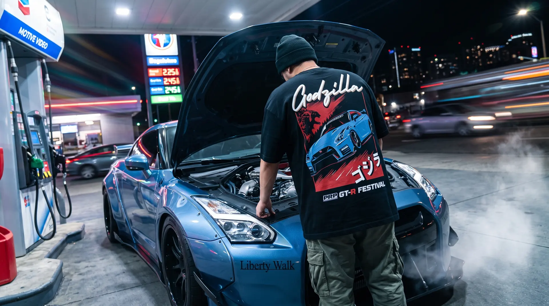 Godzilla tee, GT-R with the bonnet up at a fuel station